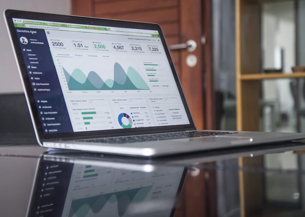 Reviewing financial analytics on a laptop — pressure-testing the numbers